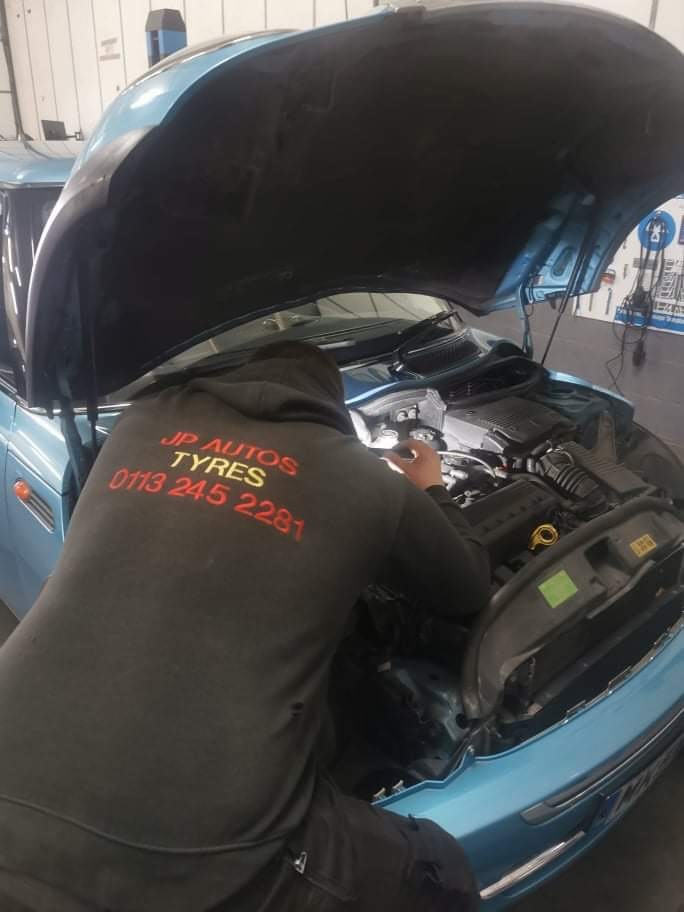 Mechanics working on a car